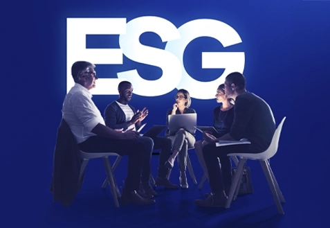 Business meeting with four participants discussing around a table, with the 'ESG' logo prominently displayed in the background.